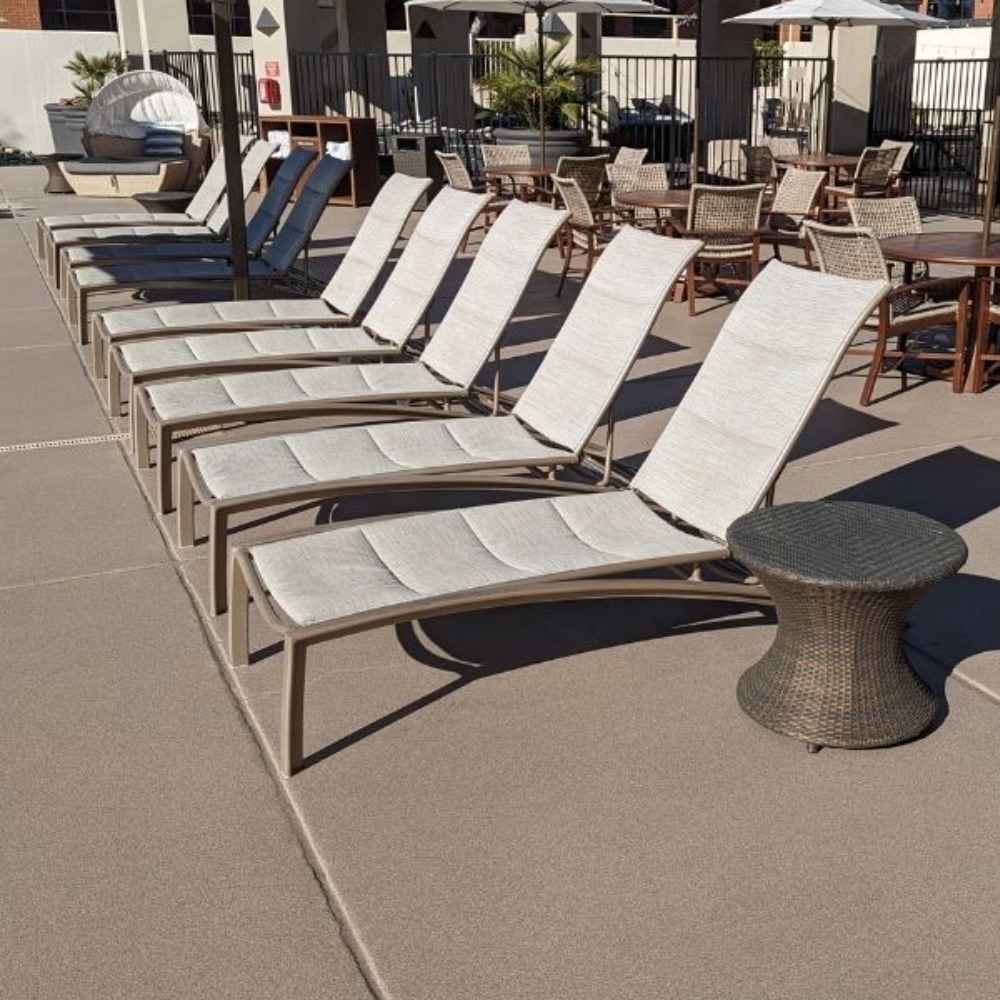 Concrete pool deck resurfacing finished around a residential pool