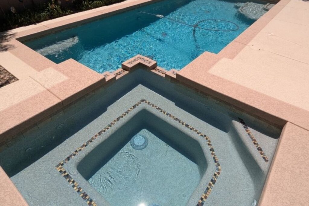 Concrete pool deck overlay showing surface slope to drainage