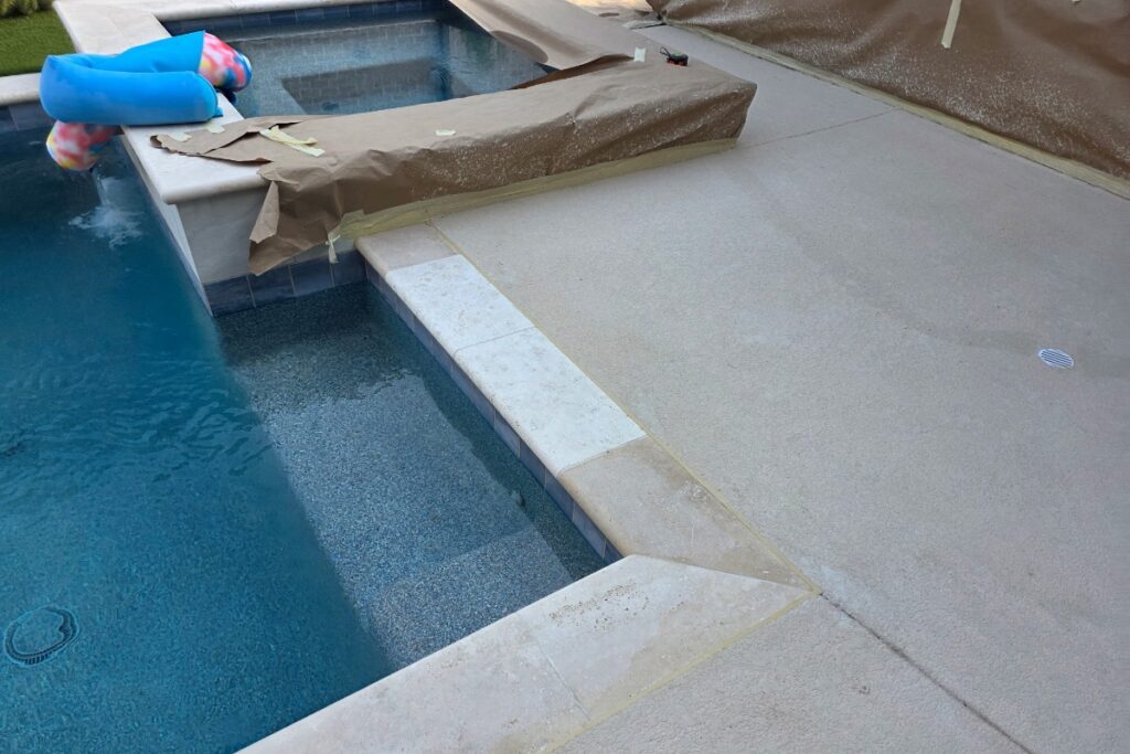 Repaired and resurfaced concrete pool deck surface