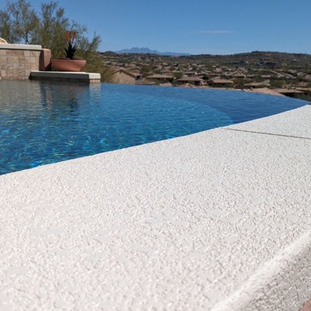 Resurfaced concrete pool deck surface
